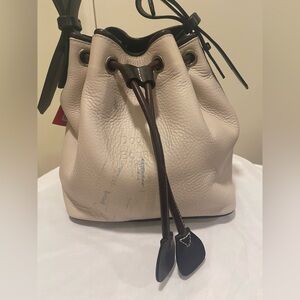 Dooney & Bourke Tan Leather Drawstring Bag with color transfer on front in pic